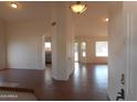 Inviting living room with tile flooring, natural light, and open archway to the kitchen at 1044 N Abner --, Mesa, AZ 85205