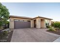 Charming one-story home featuring a brick driveway and desert landscaping at 13330 W Milton Dr, Peoria, AZ 85383