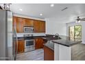 Well-lit kitchen featuring stainless steel appliances and sleek countertops at 1367 S Country Club Dr # 1221, Mesa, AZ 85210