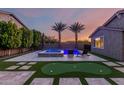 Spacious backyard with pool, spa, putting green, and ample patio space for outdoor enjoyment at 14481 W Via Del Oro --, Surprise, AZ 85379
