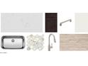 Showcasing elegant kitchen finishes, including countertops, backsplash, cabinets, sink, faucet, hardware, and flooring at 16189 W Bajada Rd, Surprise, AZ 85387