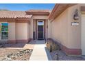 Close up of the front entrance, featuring a welcome sign, desert landscaping, and the house number displayed at 16417 S 43Rd Pl, Phoenix, AZ 85048