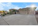 Charming single-story home featuring a three-car garage and low-maintenance desert landscaping at 32020 N 20Th Dr, Phoenix, AZ 85085