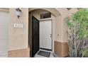 Close up of a front door with security screen and desert landscaping at 4167 E Hallihan Dr, Cave Creek, AZ 85331