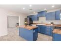 The newly renovated kitchen is equipped with butcher block countertops and a full suite of stainless steel appliances at 4238 W Krall St, Phoenix, AZ 85019