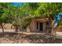 A covered front porch with wood columns with stone detail and paver driveway at 4277 N 180Th Ln, Goodyear, AZ 85395
