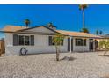 Quaint single-level house showcasing desert-friendly landscaping and neutral color scheme at 4526 W Mission Ln, Glendale, AZ 85302