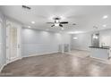 Bright living room showcasing wood-look floors, a ceiling fan, and an open floorplan at 5550 N 16Th St # 166, Phoenix, AZ 85016