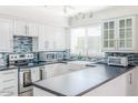 Well-lit kitchen featuring sleek countertops, updated stainless appliances, and backsplash at 6945 E Osborn Rd # B, Scottsdale, AZ 85251