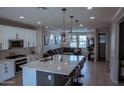 Open concept with kitchen island, dining area and living room at 1183 S Tumbleweed Ln, Chandler, AZ 85286