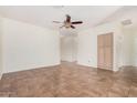 Spacious living room features tile flooring, a ceiling fan, and ample natural light at 125 N 22Nd Pl # 128, Mesa, AZ 85213