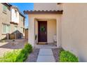 Inviting front entrance with a dark brown door with wreath, a 'hello' mat, and well-manicured bushes at 1255 N Arizona Ave # 1013, Chandler, AZ 85225