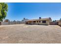 A spacious backyard with a covered patio and expansive yard at 12602 N 38Th Ave, Phoenix, AZ 85029