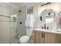Beautifully updated bathroom with a glass-enclosed shower and modern vanity at 1352 W Naranja Ave, Mesa, AZ 85202