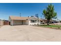 Wide driveway leading to a carport, showcasing ample parking space for residents and visitors at 1712 N Old Colony --, Mesa, AZ 85201