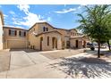 Attractive row of stucco homes featuring covered porches and low maintenance front yards at 21182 E Stonecrest Dr, Queen Creek, AZ 85142