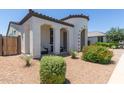 View of the front yard featuring low maintenance desert landscaping, cozy covered porch, and stucco exterior walls at 22853 E Calle Luna --, Queen Creek, AZ 85142