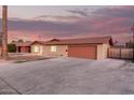 Beautiful single-Gathering home featuring a spacious driveway, a two-car garage and a well-manicured lawn at 3513 W Maryland Ave, Phoenix, AZ 85019
