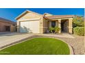 Attractive home with a well-manicured front yard and a two-car garage at 3532 W Mesquite Ave, San Tan Valley, AZ 85144