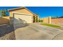 Welcoming home featuring low-maintenance landscaping and attached two-car garage at 3532 W Mesquite Ave, San Tan Valley, AZ 85144