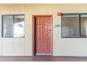 Apartment entrance with a warm door and two windows for natural light and a welcoming atmosphere at 424 S 2Nd St # 203, Phoenix, AZ 85004