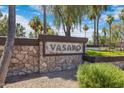 Stone community welcome sign showcasing the name 'Vasaro' with beautiful landscaping at 4327 E Capricorn Pl, Chandler, AZ 85249