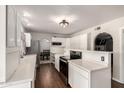 Bright kitchen features white cabinets, modern appliances, and an open design, great for entertaining at 4419 W Vogel Ave, Glendale, AZ 85302