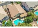 Aerial view showcasing the backyard pool, patio, and well-maintained landscaping at 45131 W Horse Mesa Rd, Maricopa, AZ 85139