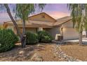 Charming single-story home with well-manicured front yard and desert landscaping at 45131 W Horse Mesa Rd, Maricopa, AZ 85139