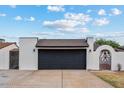 Charming single-story home with a spacious driveway and a two-car garage at 5343 W Vogel Ave, Glendale, AZ 85302