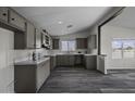 Modern kitchen features updated appliances, ample cabinet space, and stylish countertops at 53925 W Stallion Rd, Maricopa, AZ 85139