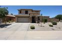 Well-maintained two-story home featuring an attached garage and a neatly landscaped front yard at 6712 W Miner Trl, Peoria, AZ 85383