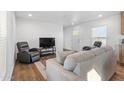 Comfortable living room featuring a cozy couch, recliners, and television set, perfect for relaxing at 701 S Dobson Rd # 203, Mesa, AZ 85202