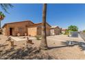 Inviting single-story home with a desert-landscaped front yard and a cozy entryway at 716 E Horizon Heights Dr, San Tan Valley, AZ 85143