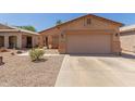 Charming single-story home with a two-car garage and low-maintenance desert landscaping at 716 E Horizon Heights Dr, San Tan Valley, AZ 85143