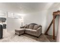 An inviting living room features neutral tones, a plush carpet, and a comfortable sectional couch at 830 S Dobson Rd # 86, Mesa, AZ 85202