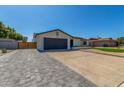 Charming single-story home with well-maintained lawn, desert landscaping, and extra long driveway at 8602 N 42Nd Dr, Phoenix, AZ 85051