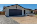 Charming single-story home with well-maintained lawn, desert landscaping, and attached two car garage at 8602 N 42Nd Dr, Phoenix, AZ 85051