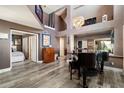 Open concept living room with hardwood floors, two story ceilings and bright decor at 10068 E San Salvador Dr, Scottsdale, AZ 85258