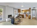 Open-concept dining area with a sleek table, stylish chairs, and a view of the modern kitchen at 1119 W Ellis Dr, Tempe, AZ 85282