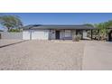 Charming single-story home featuring low maintenance desert landscaping and shaded parking at 1616 E Pecan Rd, Phoenix, AZ 85040