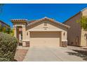 Charming single-story home featuring a two-car garage, desert landscaping, and a welcoming facade at 17493 N Costa Brava Ave, Maricopa, AZ 85139