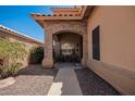 Covered front porch with stone archway and seating area at 1751 W Mulberry Dr, Chandler, AZ 85286