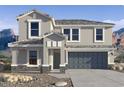 Beautiful, two-story home with a three-car garage and stone accents at 2309 S 125Th Dr, Avondale, AZ 85323