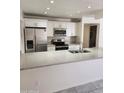 Modern kitchen featuring stainless steel appliances, granite countertops, and white cabinets at 3329 W Ross W Ave, Phoenix, AZ 85027