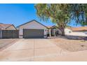 Charming single-story home featuring a well-manicured lawn, desert landscaping, and a two-car garage at 3608 W Fairview Ln, Chandler, AZ 85226