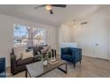 Cozy living room featuring a comfortable sofa, modern décor, and natural light at 3608 W Fairview Ln, Chandler, AZ 85226