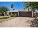 Well-maintained single Gathering home with a spacious driveway and a two-car garage at 3839 E Friess Dr, Phoenix, AZ 85032