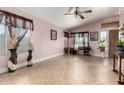 Spacious living room filled with natural light, featuring neutral walls, and tile flooring at 403 N Monte Vista St, Chandler, AZ 85225