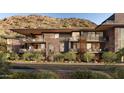 Modern building showcasing balconies and desert landscaping against a mountain backdrop at 5050 N Camelback Ridge Dr # 2306, Scottsdale, AZ 85251